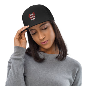 God lives here Trucker Cap